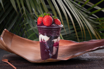 Acai cup with strawberry topping. Fruit from the Amazon.