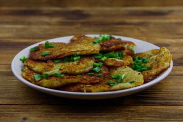 Potato pancakes on a wooden table