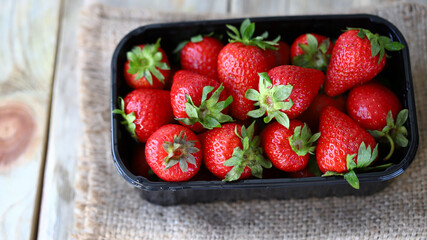 Organic strawberries in a tray. Fresh strawberries. Environmentally friendly products.