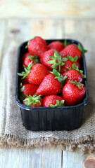 Organic strawberries in a tray. Fresh strawberries. Environmentally friendly products.