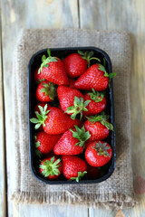 Organic strawberries in a tray. Fresh strawberries. Environmentally friendly products.