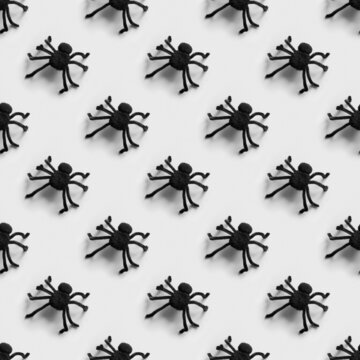 Halloween Seamless Pattern Of Many Black Spiders On Gray Background.