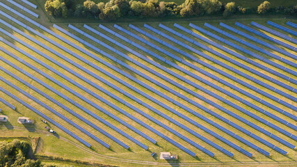 Solar power farm in the evening, fields of West Sussex, UK.