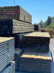 Piles of pressure treated timber.