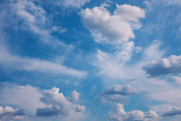 Blue sky with white clouds. Bright air background at sunny day.