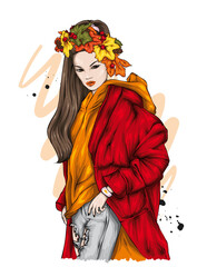 Beautiful stylish girl in stylish clothes and a wreath of autumn leaves. Fashion and style, clothing and accessories. Autumn.