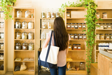 Rear view of a customer choosing products