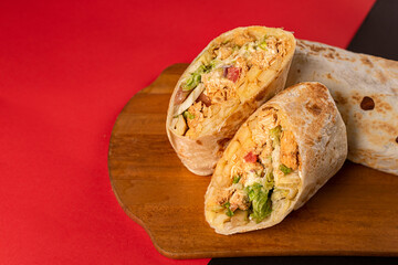 Mexican food - stuffed burritos with chicken and fries