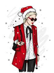 A beautiful girl in stylish clothes and a New Year's hat. New Year and Christmas, Santa Claus. Fashion & Style.
