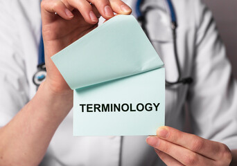 Medical terminology word in doctor hands. Medicine terms concept.