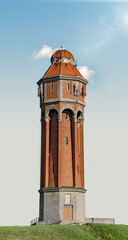 Fototapeta premium Old Water Tower On Blue Clear Sky