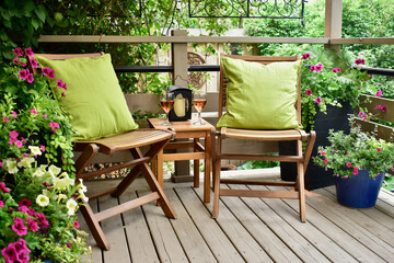 Outdoor oasis setting in secluded backyard deck at summer vacation rental in lush, luxury setting...