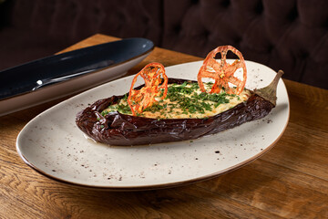 Veggie stuffed aubergine menu with quinoa on a rustic wooden background