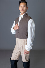 A Regency gentleman standing against a studio backdrop