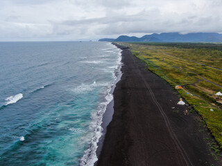 Soft waves and beautiful sand beach. Aerial view drone shot on the Khalaktyrsky beach, Kamchatka.