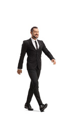Full length shot of a happy businessman walking fast