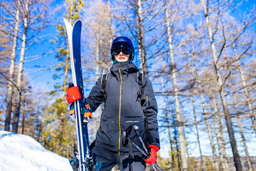 young sweden man in forest ready to drive on ski