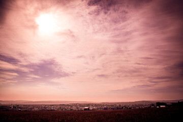 The village is in the heat under the bright sun.