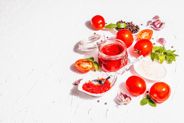 Tomato confiture, jam, chutney, sauce in a glass jar