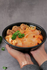 Traditional food from Bandung, Indonesia (Seblak). This dish contains noodles, wet crackers, and spicy gravy, as well as meatballs.