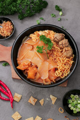 Traditional food from Bandung, Indonesia (Seblak). This dish contains noodles, wet crackers, and spicy gravy, as well as meatballs.