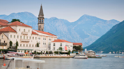 Fototapeta premium Perast,Montenegro,along the Bay of Kotor,and dramatic mountains overlooking it's calm waters.