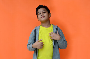 Handsome Indonesian students with enthusiastic expressions go to school