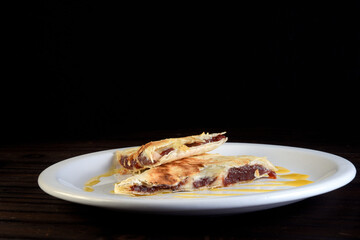 delicious mexican food tacos, guacamole, quesadillas, chilli, tortilla, burritos isolated on black background.