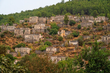 Fototapeta na wymiar Kayaköy village serves as a museum and is a historical monument. Around 500 houses remain as ruins and are under the protection of the Turkish government, including two Greek Orthodox Churches