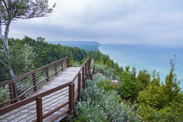 Wooden staircase down the side of a hill with Lake Michigan in background