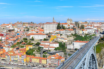 Fototapeta na wymiar Aerial view of the city of Porto, with its colorful houses. On the right, the Luis 1st bridge. Portugal.
