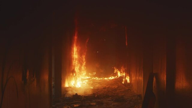 Firemen running through fire and looking for survivors