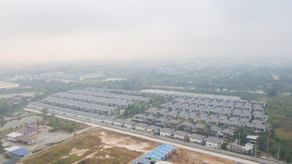 bad air with PM 2.5 dust in the atmosphere  in the city,blurred sky dark with air pollution smoke cloud dust mist for background, problem in atmosphere sky environment, toxic pollution in atmosphere s