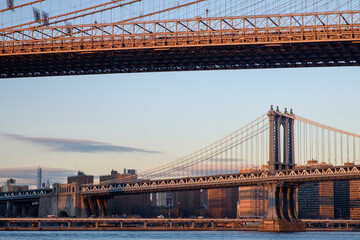 The Brooklyn Bridge and the Manhattan bridge spanning the East River from Brooklyn into Lower Manhattan and the financial district of New York City