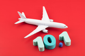 Airplane and numbers on October 1st on a red background