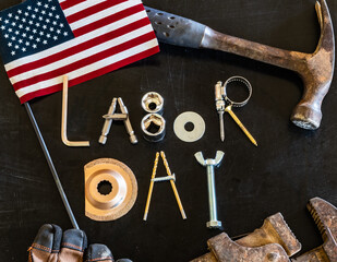 Labor Day message in tools and hardware on chalkboard for celebrating this American holiday
