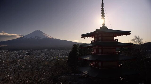 Japanese landscape of beautiful Chureito red Pagoda and Mt. Fuji with snow cover on the top in the winter. Fujiyoshida landmark travel place at Japan-Dan