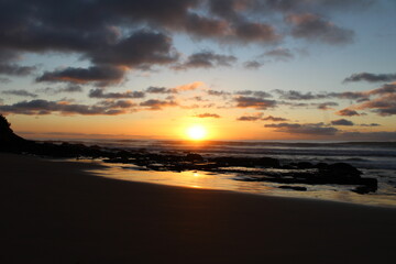 Fototapeta na wymiar Beach rocks sunset
