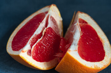 slices of grapefruit close-up on a blue background