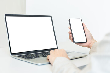 computer screen,cell phone blank mockup.hand woman work using laptop texting mobile.white background for advertising,contact business search information on desk in cafe.marketing,design