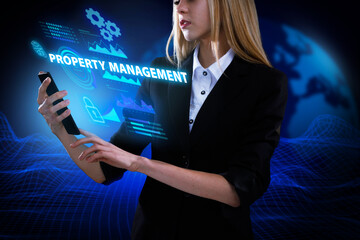Business, Technology, Internet and network concept. Young businessman working on a virtual screen of the future and sees the inscription: Property management