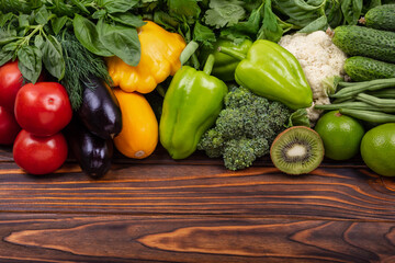 Healthy vegan food. Ingredients. Vegetarian diet food concept. Fresh vegetables knolling composition. Flat lay with various vegetables on wooden table. Fresh vegetables arranged symmetrically on board