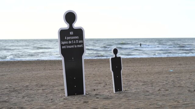 Warning Sign At The Beach Written In Black Human Shape Standee Due To Drowning In Strong Sea Current