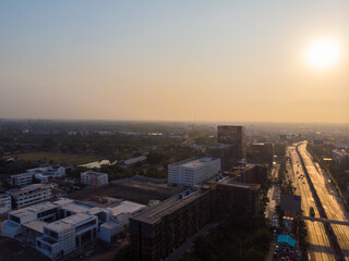 Fototapeta na wymiar Aerial view morning sunrise city building with transport road