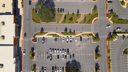 Aerial drone shot of shopping center parking area, drone 4K
