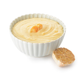 Bowl of tasty mashed potatoes with garlic on white background