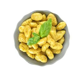 Bowl with tasty pesto gnocchi on white background