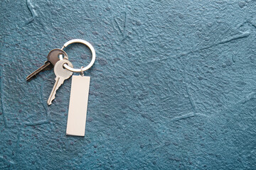 Keys with stylish keychain on dark background