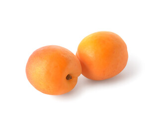 Tasty ripe apricots on white background