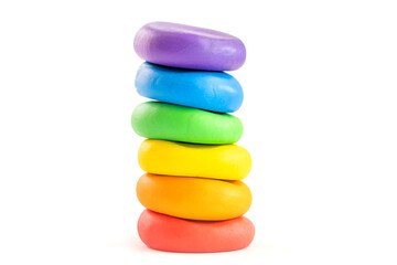 Multicolored circle shape plasticine placed on a white background. Play dough